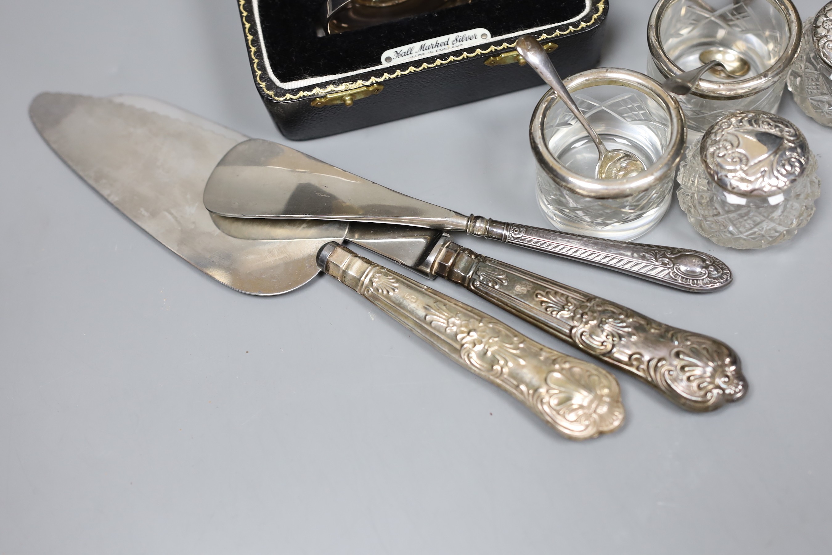 An Art Deco design silver christening can, Birmingham 1961, with fitted case, a toastrack and seven silver mounted items, 5 oz of weighable silver